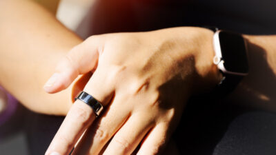 Woman wearing smart ring on her hand. Concept sport and healthy lifestyle